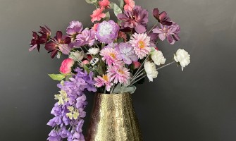 Oranje zijden bloemen decoratie: zo breng je warmte en karakter in je interieur